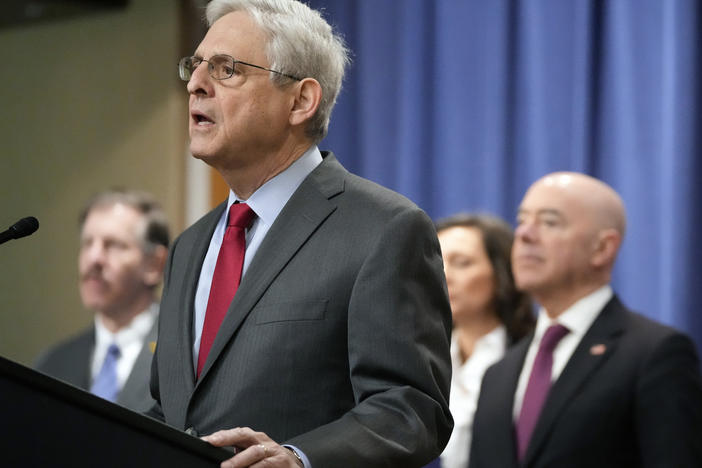 Attorney General Merrick Garland speaks with reporters during a news conference at the Department of Justice on Wednesday as Secretary of Homeland Security Alejandro Mayorkas, right, looks on.