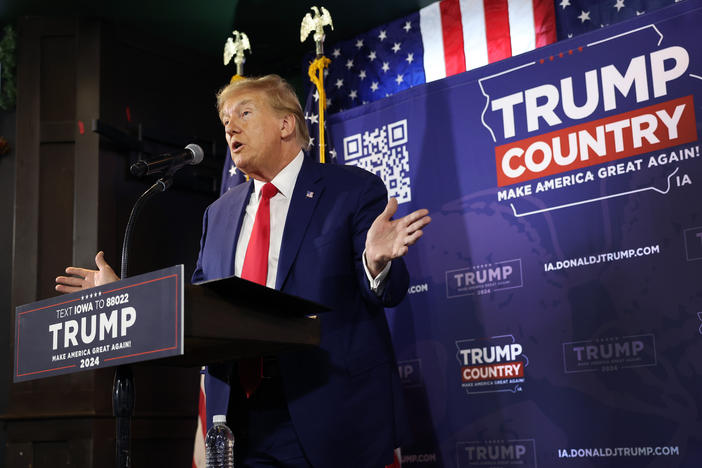 Former President Donald Trump speaks at a campaign event in Ankeny, Iowa.