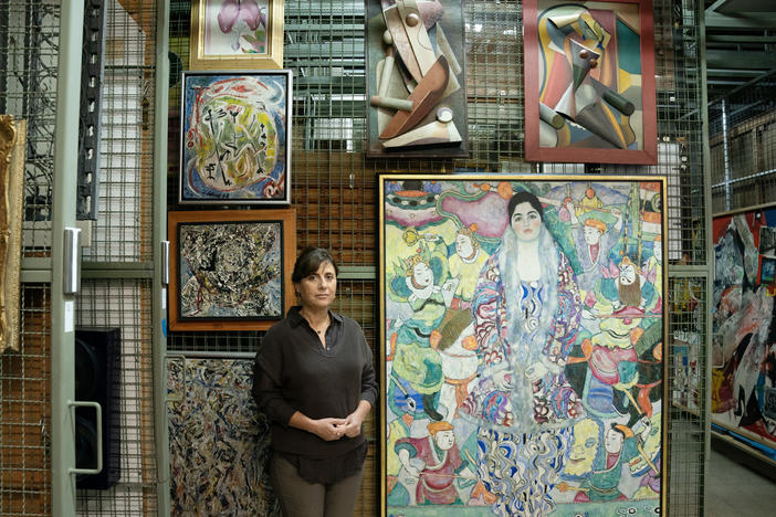 Artwork from the Tel Aviv Museum of Art, which were moved into the museum's underground safe to protect them from possible damage caused by rocket attacks, amid the ongoing conflict between Israel and Hamas, on Nov. 14. Tel Aviv museum director Tania Coen-Uzzielli poses in front of Gustav Klimt's "Portrait of Friederike Maria Beer," 1916.