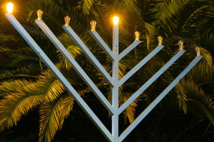 A Menorah stands partly lit outside Hackney Town Hall to mark the arrival of Hanukkah on December 7, 2023 in London, England.