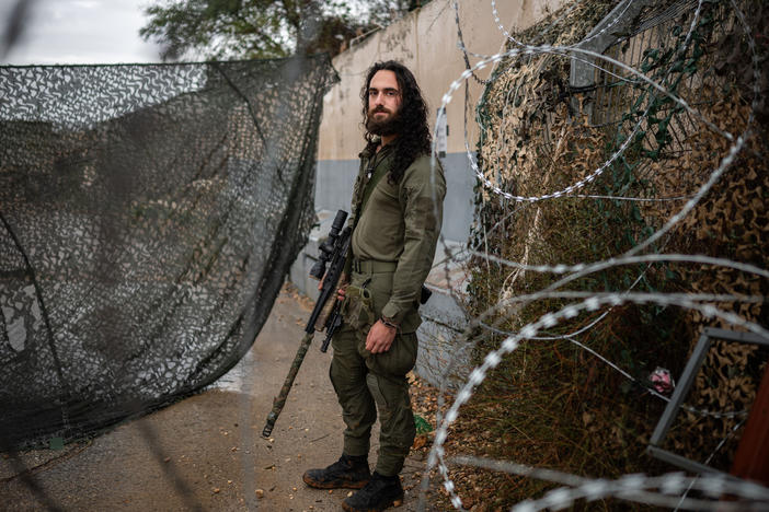 Amit Michelson, an Israeli military reservist, stands for a portrait at a military base near the border with Lebanon in northern Israel on Nov. 28.