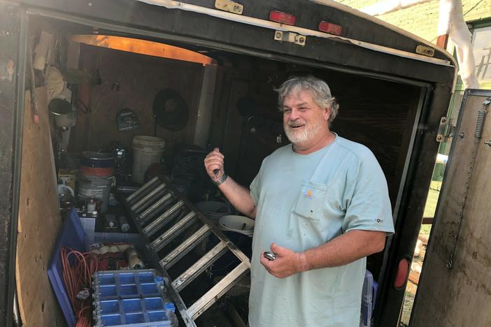 Doug Layton, Jr. shows a trailer full of equipment he's acquired since being released from prison. He says he does painting and home repairs on the side, "trying to be productive in society."