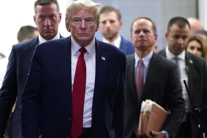 Former President Donald Trump departs for a break during his civil fraud trial in New York City on Thursday.