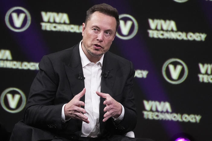 Elon Musk, who owns X, Tesla and SpaceX, speaks at the Vivatech fair, June 16, 2023, in Paris.