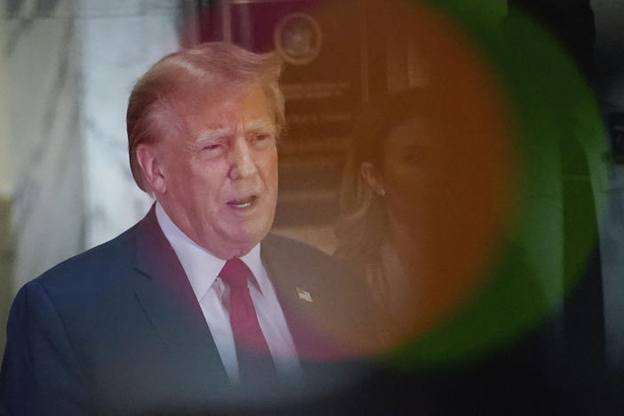 Former President Donald Trump speaks after exiting the courtroom for a break at New York Supreme Court on Dec. 7 in New York.