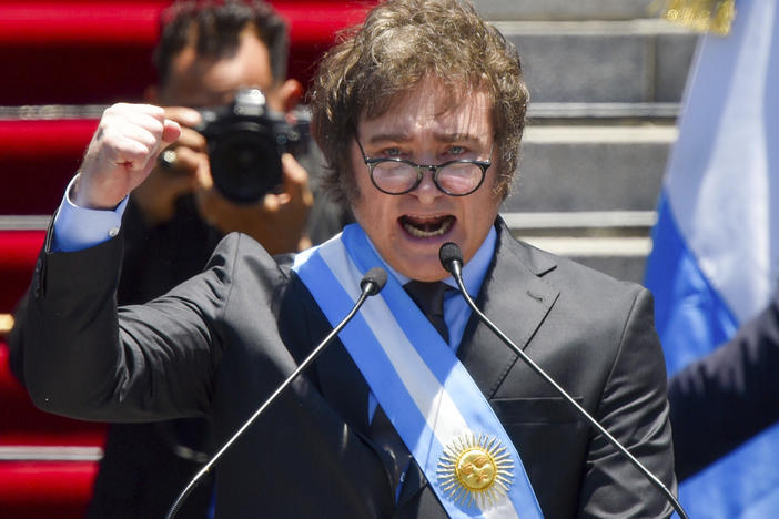 Argentina's newly sworn-in President Javier Milei speaks outside the Congress in Buenos Aires, Argentina, Sunday, Dec. 10, 2023.