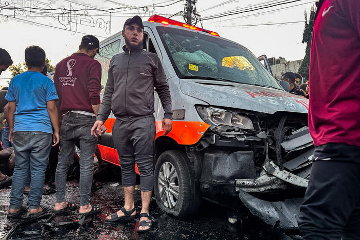 An Israeli air strike damaged this ambulance in front of Al-Shifa hospital in Gaza City on November 3. Israel said the vehicle was "identified ... as being used by a Hamas terrorist cell" and that a "number of Hamas terrorist operatives were killed." Hamas denied the presence of fighters in the ambulance convoy, calling the claims "baseless."