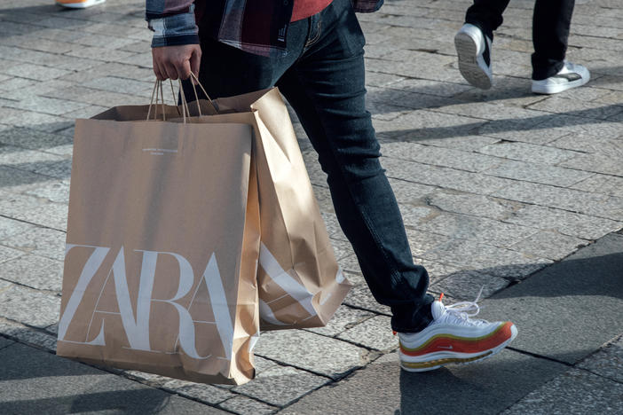 A shopper carries Zara shopping bags in Paris. The fashion company said it regrets that some customers were offended by its latest ad campaign.