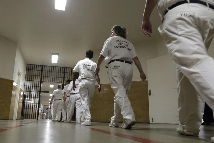 Women at the Tutwiler Prison in Wetumpka, Ala., walk through the halls. This week, current and former prisoners announced a lawsuit challenging Alabama's prison labor program as a type of modern slavery.