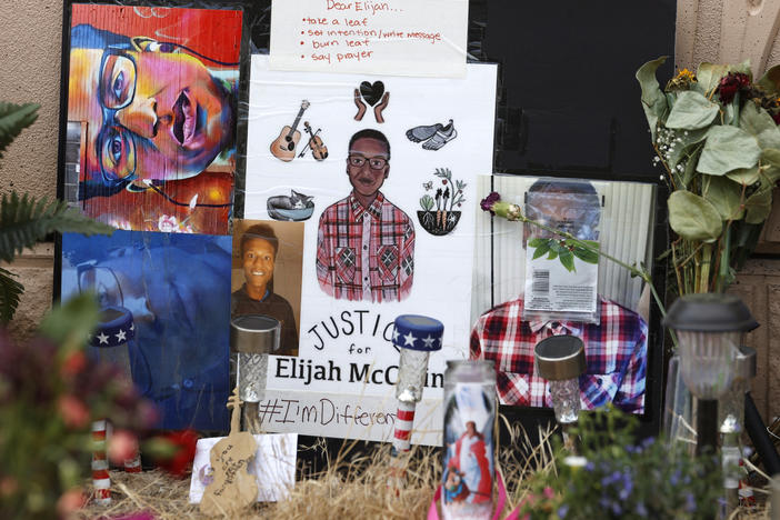In this July 3, 2020, file photo, a makeshift memorial stands at a site across the street from where Elijah McClain was stopped by police officers while walking home in Aurora, Colo.