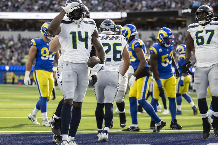 Seattle Seahawks wide receiver DK Metcalf (14) celebrates his touchdown by using American Sign Language during an NFL football game against the Los Angeles Rams, Sunday, Nov. 19, 2023, in Inglewood, Calif.