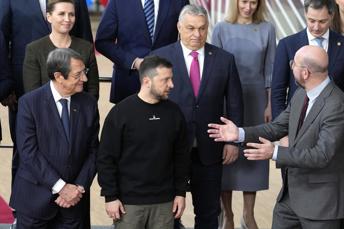 European Council President Charles Michel, front right, speaks with Ukraine's President Volodymyr Zelenskyy, front second right, and Hungary's Prime Minister Viktor Orban, second row center, as they pose with other European Union leaders for a group photo at an EU summit in Brussels on Thursday, Feb. 9, 2023.