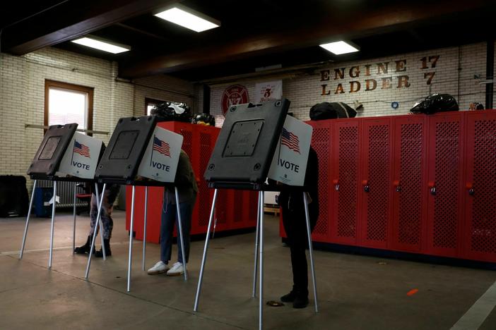 Voters cast their ballots during the midterm elections at the Detroit Fire Station 17 on Nov. 8, 2022.