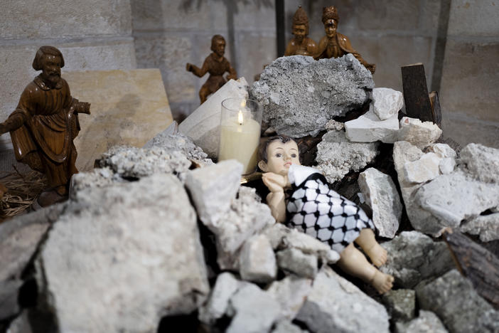 A view of the Evangelical Lutheran Christmas Church's Nativity scene in Bethlehem. This year, it portrays a baby Christ born under rubble and wrapped up in a Palestinian <a href="https://www.npr.org/2023/12/06/1216150515/keffiyeh-hamas-palestinians-israel-gaza">keffiyeh</a>.