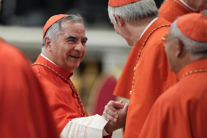 Cardinal Angelo Becciu attends a consistory inside St. Peter's Basilica, at the Vatican, on Aug. 27, 2022.