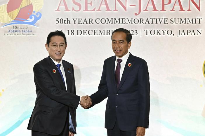 Japan's Prime Minister Fumio Kishida, left, greets Indonesia's President Joko Widodo upon arrival for the opening session of ASEAN-Japan Commemorative Summit Meeting at the Hotel Okura Tokyo in Tokyo Sunday, Dec. 17, 2023.