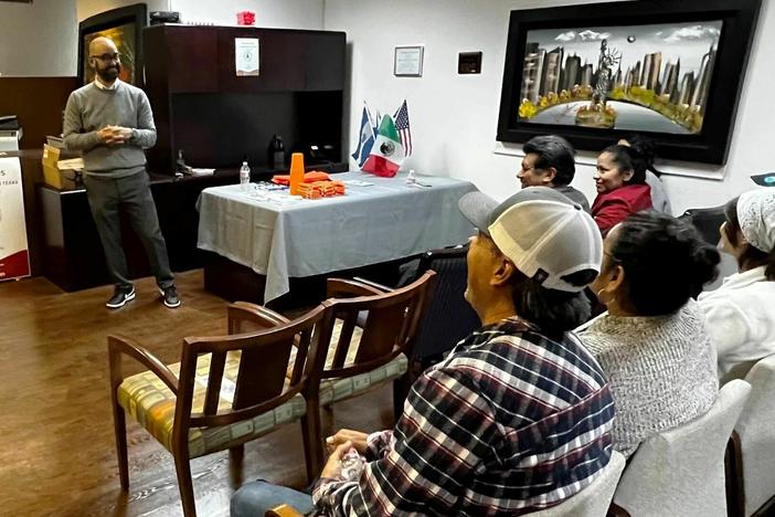 Haim Vasquez, an immigration attorney, talks to residents in Garland, Texas about new state border enforcement laws that will go into effect early next year. He says he wants immigrants to know their rights in case they get detained or arrested by law enforcement.