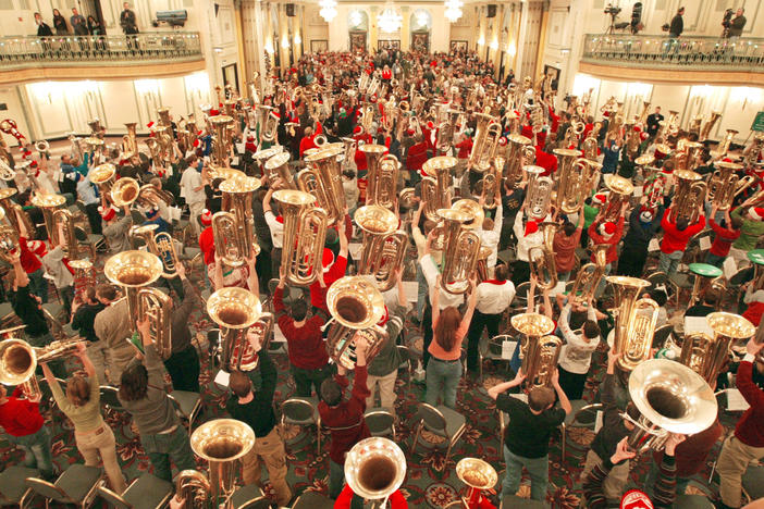 Hundreds of musicians display their tubas after completing TubaChristmas Dec. 18, 2003, in Chicago.