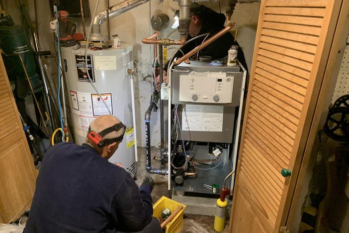 Oval Heating and A/C workers install a more efficient condensing gas boiler in a Sharon Hill, Pennsylvania home. New Department of Energy efficiency standards can only be met with these boilers or furnaces, which save customers about 15% on their gas utility bill.