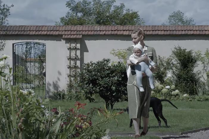 Sandra Hüller plays a mother who lives next door to Auschwitz in <em>The Zone of Interest.</em>