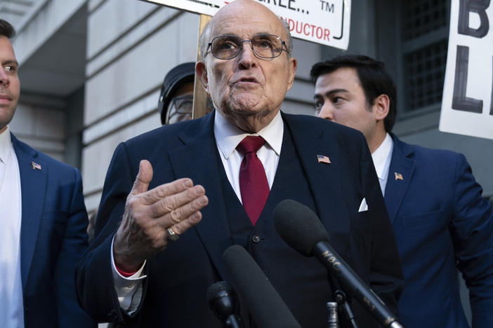 Rudy Giuliani speaks during a news conference after his defamation trial outside the federal courthouse in Washington, on Dec. 15. A jury awarded $148 million in damages to two former Georgia election workers who sued Giuliani for defamation over lies he spread about them in 2020 that upended their lives with racist threats and harassment. (A judge lowered the jury's award to $146 million.)