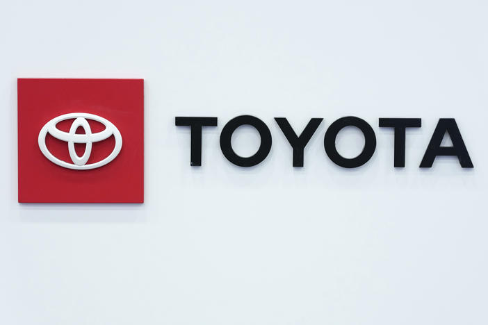 The Toyota logo is seen on Sept. 13 at the North American International Auto Show in Detroit. That automaker says it is recalling 1 million vehicles over a defect that could cause airbags not to deploy, increasing the risk of injury.
