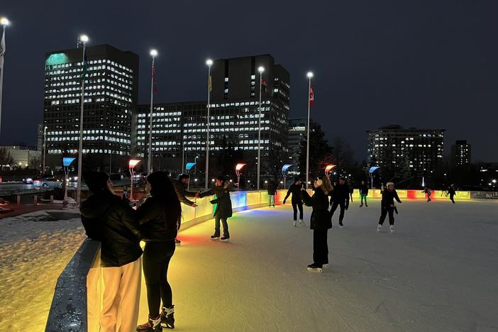 Ice skaters in front of Ottawa City Hall in Ontario on Dec. 12, 2023.