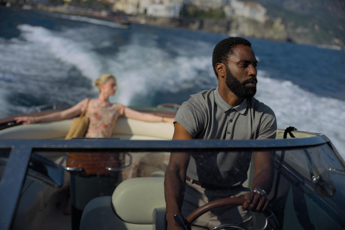 Elizabeth Debicki and John David Washington star in director Christopher Nolan's time-warping film, <em>Tenet</em>.