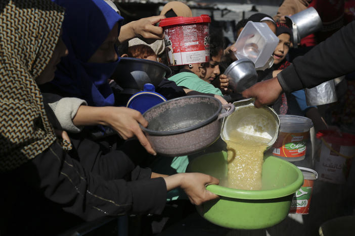 Palestinians line up for a meal in Rafah on Wednesday.