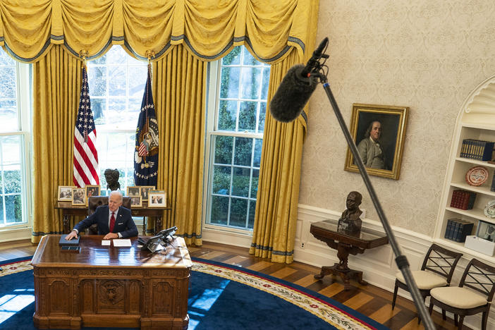 U.S. President Joe Biden is seen in the White House Oval Office of in January 2021 in Washington, D.C., as Vice President Kamala Harris looks on.