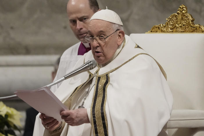 Pope Francis presides over Christmas eve Mass, at St. Peter's Basilica at the Vatican, on Sunday.