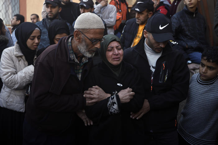 Palestinians mourn relatives killed in the Israeli bombardment of the Gaza Strip outside a morgue in Khan Younis on Sunday.