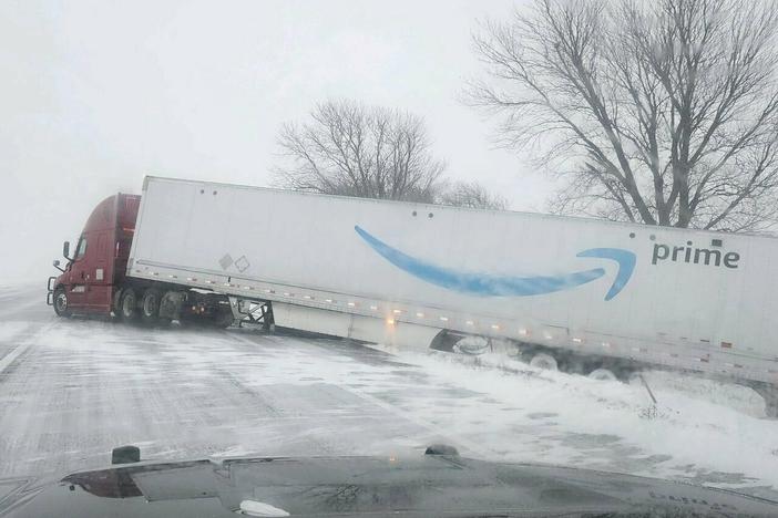 A tractor trailer veers into ditch on Christmas Day on Interstate 80 in Nebraska as a winter storm pummels part of the Midwest. Forecasters are predicting that heavy snow and blizzard conditions will continue through early Wednesday across part of the north-central U.S.
