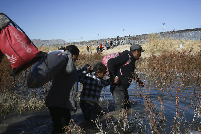 Migrants cross the Rio Grande river to reach the United States from Ciudad Juarez, Mexico, on Wednesday, Dec. 27, 2023.