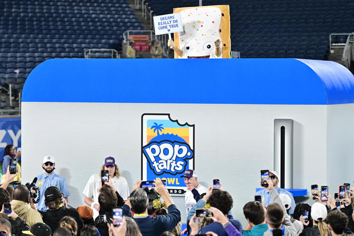 The Pop-Tarts mascot is lowered into a toaster following the 2023 Pop-Tarts Bowl between the Kansas State Wildcats and the NC State Wolfpack at Camping World Stadium on Thursday in Orlando, Fla.