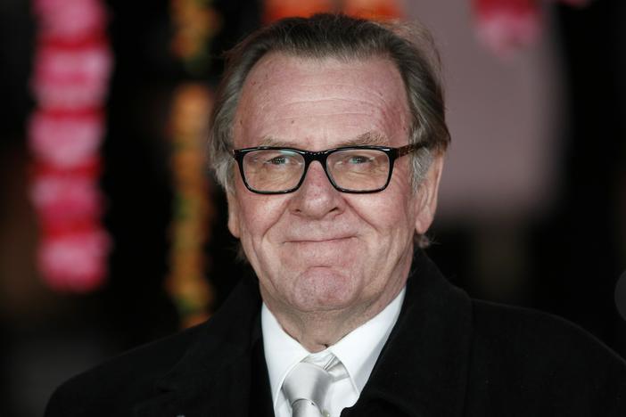 English actor Tom Wilkinson poses for photographers on the red carpet ahead of the Royal and World Premiere of the film <em>The Second Best Exotic Marigold Hotel</em> in London on Feb. 17, 2015.