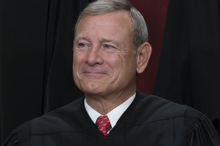 Chief Justice of the United States John Roberts is shown joining other members of the Supreme Court as they pose for a new group portrait, at the Supreme Court building in Washington, Friday, Oct. 7, 2022.