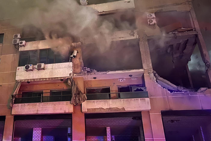 Smoke rises from a destroyed apartment following a large explosion in a southern suburb of Beirut on Tuesday. The TV station of Lebanon's Hezbollah group says top Hamas official Saleh Arouri was killed Tuesday in an explosion in a southern Beirut suburb.
