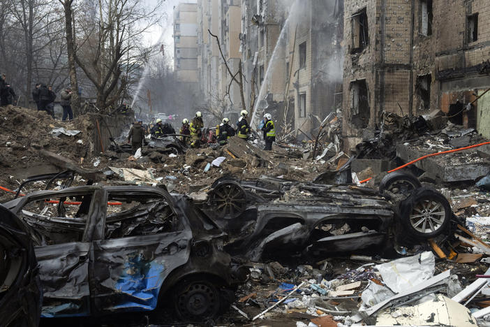 Firefighters work to extinguish a fire in a destroyed apartment building after a Russian attack in Kyiv, Ukraine, on Tuesday.