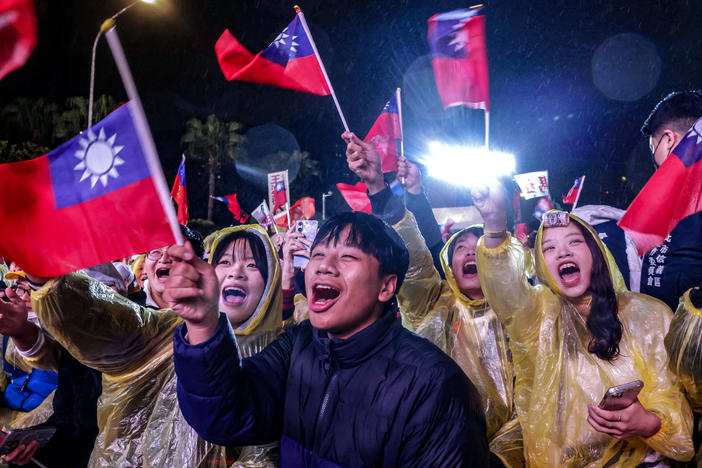 Supporters attend a campaign rally for Taiwan's main opposition party, Kuomintang, ahead of this month's presidential election, in Taipei on Dec. 23.