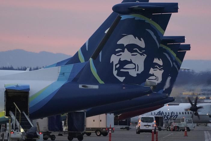 Alaska Airlines planes are shown parked at gates at sunrise, March 1, 2021, at Seattle-Tacoma International Airport in Seattle.