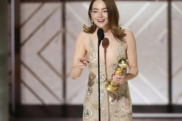 This image released by CBS shows Emma Stone accepting the award for best female actor in a motion picture for her role in "Poor Things" during the 81st Annual Golden Globe Awards in Beverly Hills, Calif., on Sunday, Jan. 7, 2024.