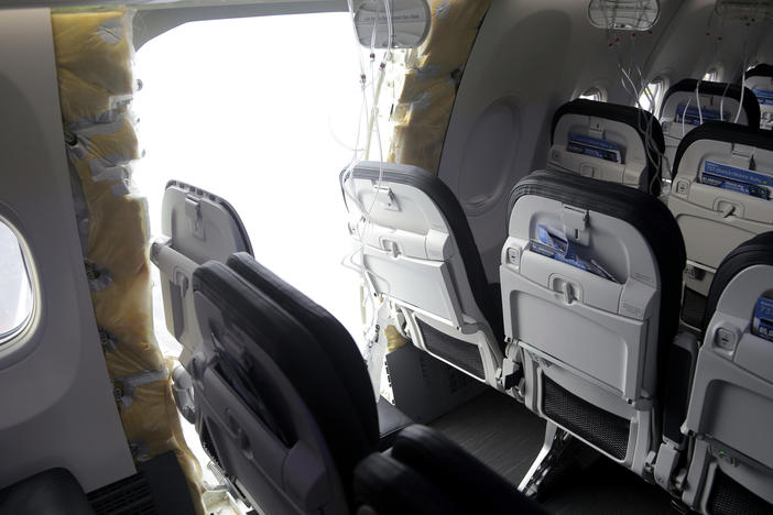 This photo released by the National Transportation Safety Board shows a gaping hole where the paneled-over door had been at the fuselage plug area of an Alaska Airlines flight in Portland, Ore. A panel used to plug an area reserved for an exit door on the Boeing 737 Max 9 jetliner blew out Jan. 5, forcing the plane to return to Portland International Airport.