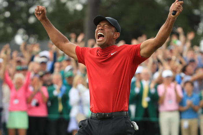 Tiger Woods celebrates on the 18th green after winning the Masters at Augusta National Golf Club on April 14, 2019 in Augusta, Georgia.