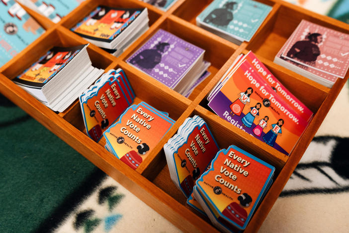 Stickers encouraging people to register to vote are available in the waiting room of the Native Health center in Phoenix.