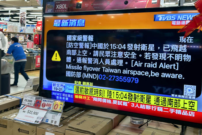 A television set, displaying news regarding a "presidential alert" message issued by the authorities to all phones in Taiwan, is seen in a hypermarket in Taipei on Jan. 9, 2024.