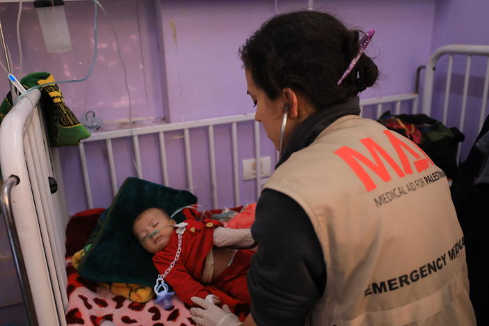 Dr. Seema Jilani treats a baby at al-Aqsa hospital in Gaza.