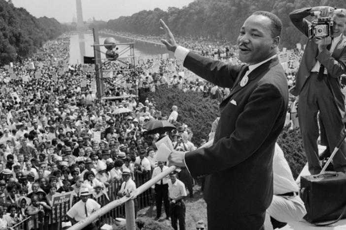 Martin Luther King Jr. stands in front of a crowd in Washington, D.C.