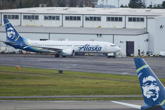 Alaska Airlines N704AL, a 737 Max 9 which made an emergency landing at Portland International Airport after a part of the fuselage broke off mid-flight on Friday, is parked at a maintenance hanger in Portland, Ore., Saturday, Jan. 6, 2024.