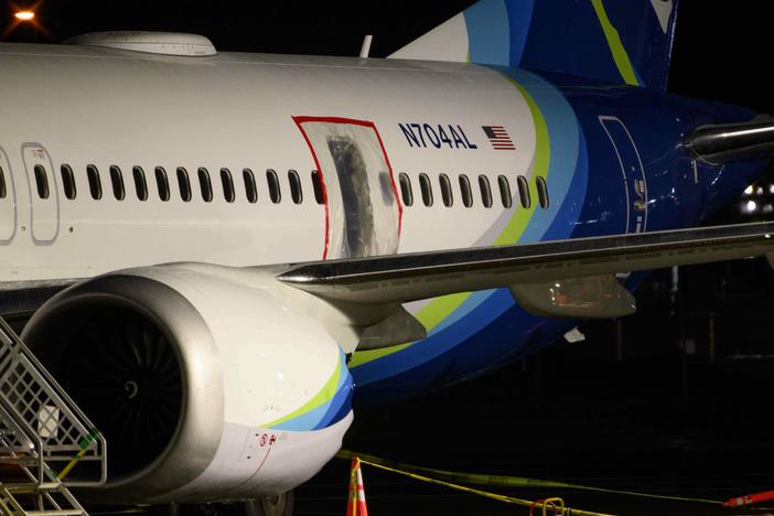 A plastic sheet covers part of the fuselage of an Alaska Airlines Boeing 737 Max 9 at Portland International Airport on Jan. 8. NTSB investigators are trying to learn why the aircraft suffered a midair fuselage blowout last Friday.